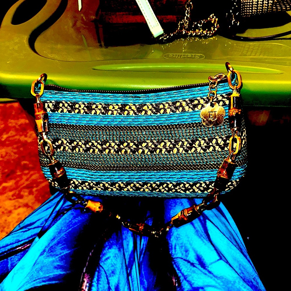 Beaded beauty with faux tortoise shell handle. Shades of blue and assorted beads